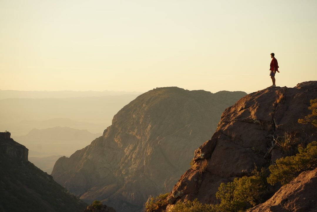 Matthew Miceli on a canyon ridge at sunset